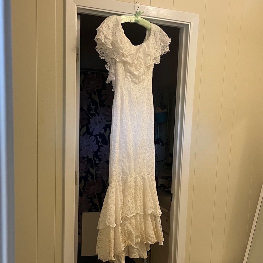 White lace ruffle off the shoulder vintage wedding dress Mike Benet Formals